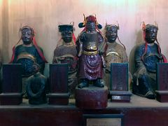 03B Some of the 10 gods of hell statues to the left of the main entrance to Man Mo Taoist Temple Hong Kong